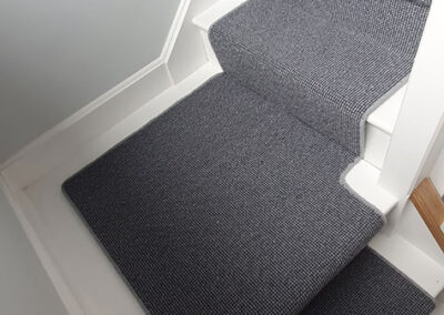 Stairs with beautiful blue/grey carpet runners