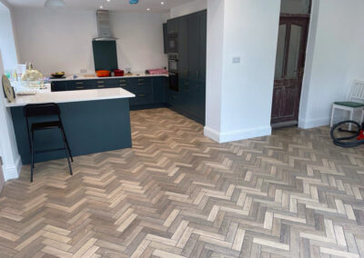 Blue kitchen with amazing ceramic herringbone floor