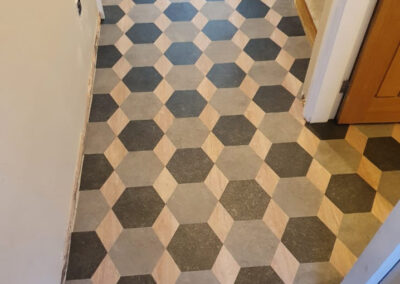 Honeycomb luxury vinyl tiles in hallway